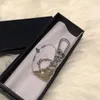 Pierścień designerski damska mody dla mężczyzn marka Black Coin Holder Biecian Luksusowe brelozę małe torebki z pudełkiem 001