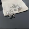 Hoge kwaliteit nieuwe keizerin-weduwe Saturnus pins liefde parel oorbellen paperclips lichte luxe oorbellen