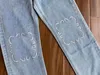Zimowy jesień dżinsy dżinsowe dżinsowe haft haft wysoki talia pusta i haftowane proste dżinsowe spodnie mody jog2308