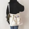 Bolsas de noche Lona de gran capacidad para mujeres Coreano Color sólido Correa ajustable Cremallera Bolsa de hombro Estudiantes Libro Bolsillo Tote Viaje