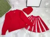 Nowy dzianinowy garnitur do kreskówki dla niemowląt Dress Girls Suits Rozmiar 100-160 Sweter i plisowana spódnica z dzianinową czapką