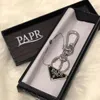 Chaves de designer Keys Fashion Fashion Key Ring for Men Brand Black Coin Holder Keychains Luxury Small Burses Keyrings com Box 001