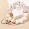 Porte-clés à la mode 1 pièces perles de silicone colorées bracelet porte-clés pour femmes fermoir à homard en cuir PU porte-clés bijoux accessoires