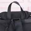 Mode NewMänner und Frauen Rucksack Qualität Designer Tasche Reisetasche Qualität Nylon Leder Dreieck Metall Logo Büchertasche Reisetasche