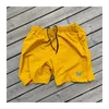 Herrshorts 2023SS svarta nålar nylon män kvinnor lila fjäril logotyp high street mesh awge byxor