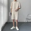 Tute da uomo Completi estivi Moda uomo T-shirt / pantaloncini casual oversize a maniche corte Due pezzi da uomo Coreano Set sportivo allentato Set corto da uomo 231021