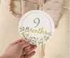 12 pezzi di biglietti commemorativi mensili per numeri miliari del bambino Carta per neonati Accessori per fotografia di età incisa in legno Regalo di nascita