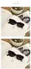 lunettes de soleil design personnalité de luxe noir cadre étroit femmes technologie haut de gamme Europe et Amérique