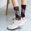 Femmes bas hommes coton chaussettes de sport longues longueurs Ins Style chaud concepteur chaussette hiver plus chaud Design de mode bonneterie