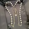 Ly Niche exagère la personnalité Design serrure tête collier de perles haut de gamme sens de la mode OL couche clavicule chaîne