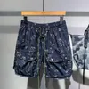 Shorts masculinos moda personalizado impresso verão multi-bolso de secagem rápida fino casual high street calças de cinco pontos roupas masculinas
