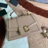 En kaliteli crossbody çanta kadın çanta çantası gerçek deri moda harfleri çıkarılabilir kayış bronz renkli donanım iç fermuarlı cep bayan omuz çantaları