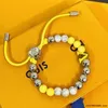 Chaîne Designer Bijoux 23 Cadeaux Corde de premier choix Bracelet de perles multicolores Nouveau représentant chanceux d'herbe à quatre feuilles pour hommes et femmes