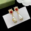 Designer de luxe Mode Charme Boucles d'oreilles Femmes Rouge Bleu Pierre précieuse Cristal Blanc Résine Pendentif Boucles d'oreilles pour les femmes de mariage cadeau de Noël bijoux