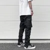 Pantaloni da uomo Harajuku neri affusolati per pantaloni da jogging in nylon casual con elastico pieghettato con cerniera impermeabile 231024