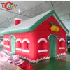 4x3x3M (13ft * 10ft * 10ft) far esplodere la casa di Natale gonfiabile con il camino tenda gonfiabile della grotta di Babbo Natale per la decorazione esterna006