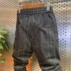 Męskie spodnie swobodny pasiaste mody streetwear na zewnątrz joggera bresowe letnie cienkie ciasne spodnie luksusowe ubranie marki 231023