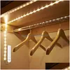 Bandes LED Strip Lights Capteur de mouvement 1M 2M Cabinet Light Tape sous lampe de lit Corde Nuit pour escaliers Couloir Placard Cuisine Drop Deli Dhr2C