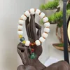 Strang-Armband, weiße Bodhi-Kürbis-Lotusblüten-Handstücke
