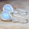 Boucles d'oreilles pendantes en pierre de lune blanche pour femmes, jolies boucles d'oreilles couleur argent, tendance, rondes, pour mariage