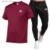 Herrspårar Summer Men's Cotton T-Shirt Kort ärm Top+Black Casual Sports Pants Tvådelar uppsättning fashionabla och bekväma kläder Q231025