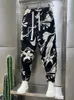 Men s byxor jogger lös randig blommig hiphop streetwear högkvalitativ harem byxor unika designer märke kläder 231025