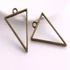 100 pièces Style Vintage Bronze argent alliage Triangle charmes colle creuse blanc pendentif plateau lunette charmes pour la fabrication de bijoux 39x25m217U