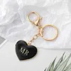 Porte-clés 100pcs alliage simple noir blanc coeur de pêche porte-clés Mr Mrs modèle sac pendentif accessoires mode amant porte-clés cadeaux