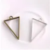 100 pièces Style Vintage Bronze argent alliage Triangle charmes colle creuse blanc pendentif plateau lunette charmes pour la fabrication de bijoux 39x25m217U