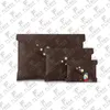 M82614 M82625 M82655 23 년은 크리스마스 지갑 신용 카드 홀더 동전 지갑 키 파우치 여권 커버 여성 패션 럭셔리 디자이너 최고 품질 M82615 M82620 M82621
