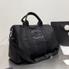 Designer-Reisetasche, Herren-Damen-Modedesigner-Reisetasche, Handtasche mit großem Fassungsvermögen, Metall-Anhänger, Canvas-Leder, einzelne Schulter-Umhängetasche, Reisetasche