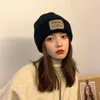 Bérets Chapeau Mode Rétro Pâte Tissu Couple Laine Femme Hiver Japonais Chaud Étudiant Version Coréenne Ins Protection des Oreilles Tricoté