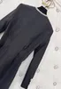 23デザイナー秋/冬のラインストーン大きな丸い首長袖ポケットデコレーションハイウエストスリムな黒いドレス