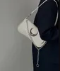 Bolsa feminina de design pequeno com fivela de lua bolsa de ombro bolsa preta nas axilas bolsa crossbody tendência da moda