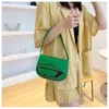 Retail Womens Bag Designer Spring Summer New Small Focus Design Mini Bright Face Sadel Bag Single Shoulder Crossbody Handheld