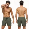 Shorts masculinos de cor sólida, calções de banho elásticos, secagem rápida, praia com bolsos com zíper e forro de malha, esporte para homens