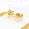 Stud Europa America Designer Luxury Women Lady Micro intarsiato Zircone pieno verde leopardo placcato orecchini a clip color oro YQ231026