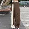 Spodnie damskie kobiety luźne zaprojektowane otwory w kieszonkowym otworze mody streetwear nieregularny wypoczynek w stylu koreańskim dama wygodna