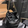 48CM surdimensionné pièce d'or transportant 22 femmes sac fourre-tout or argent matériel sac à main de luxe en cuir matelassé bandoulière sac de créateur avec sac à main voyage valise de shopping