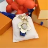 Fashion Keychain Luxury Designer Stylish Sun-Flower Doll Pendant Keychains Buckle Mens Womens Väskor Keys Ring Ornament High Quality Gift With Box och Dustbag J54