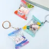 Porte-clés longes Vograce forme personnalisée sac de bonbons gonflable Shaker charme Anime Transparent acrylique bonbons porte-clés 231025