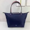 2024 Designer Sac fourre-tout classique en nylon bourse grande capacité femmes duffle week-end bagages bandoulière bandoulière hommes hobo embrayage sacs de shopping sacs à main de voyage