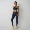 Conjuntos ativos cor sólida conjunto de yoga leggings apertados esportes fitness um ombro ginásio sutiã superior 2 pçs terno treino treinamento feminino carga bolso pregas