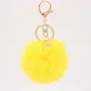 Nyckelringar Kvinnor Päls Key Chain Car Keychain Pom Pompom Färger med Hexagonal Bag Charm Söta ringsmycken