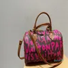 Designer Femmes Graffiti Sac fourre-tout Boston Sacs à main imprimés Sacs à main à bandoulière Lady Monogrammes En cuir Toile Oreillers Sac à main Bandoulière