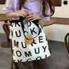 Bolso de compras de supermercado de un solo hombro para mujer, bolso o billetera de lona versión coreana a la moda, 2023