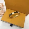 Hollow Out Snap Micro Inlays Pulsera de cristal Diseñador de la marca Cobre Trébol de cuatro hojas Flor Brazalete abierto para mujer Joyería con caja Regalo de fiesta FHDT