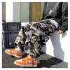 Pantaloni da uomo Pantaloni mimetici vintage 2023 Streetwear Uomini Cargo Gamba larga Tasche larghe Jogger Pantaloni a vita bassa larghi