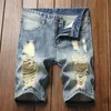 Ny sommarblå färg denim shorts modedesigner kort rippade jeans män förstörde män jeans shorts nya byxor277y