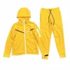 2023 nuovi pantaloni Tech Fleece Mens Designers Pantaloni con cappuccio Giacche Sport Spazio Pantaloni di cotone Donna Pantaloni tuta Uomo Jogging Running pile giallo I5QD #